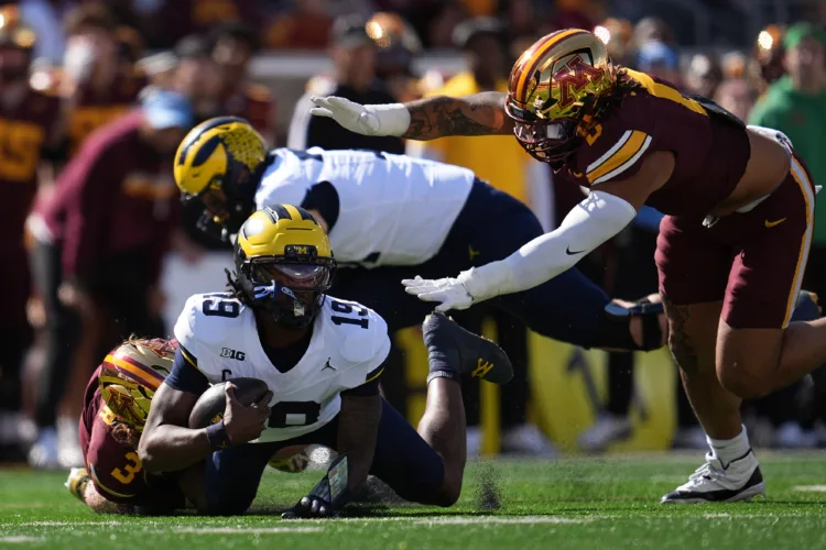 Minnesota beats Michigan 20-14 behind a dominant defense for a rare lift of the Little Brown Jug